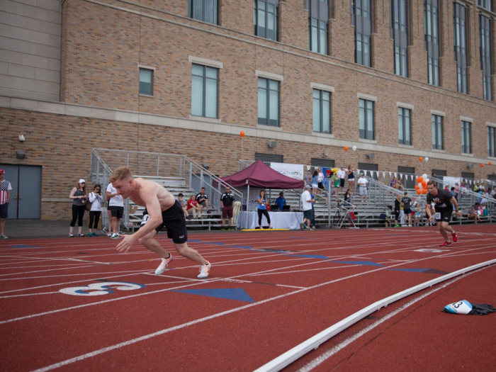 Andrew Geenen from Citi and Francis Nassau from Highbridge at the start of the 400 meter race.