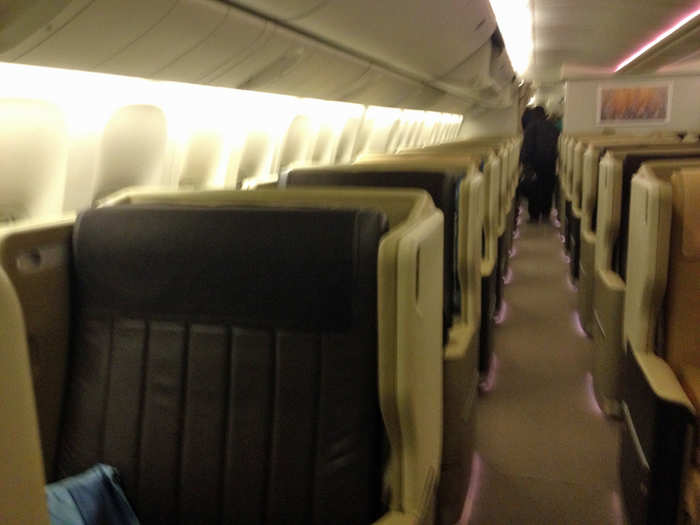 Like most airplanes, you have to walk through business class before entering economy. It