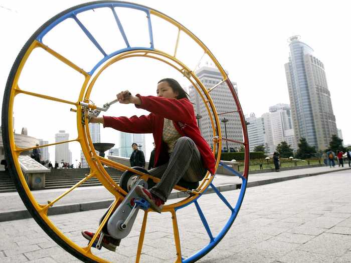 This woman took her extreme unicycle for a ride through Shanghai.