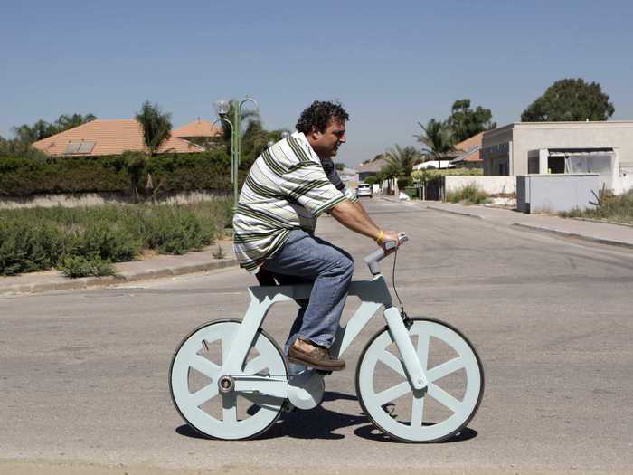 Israeli inventor Izhar Gafni rides his most clever invention yet: a cardboard bicycle.