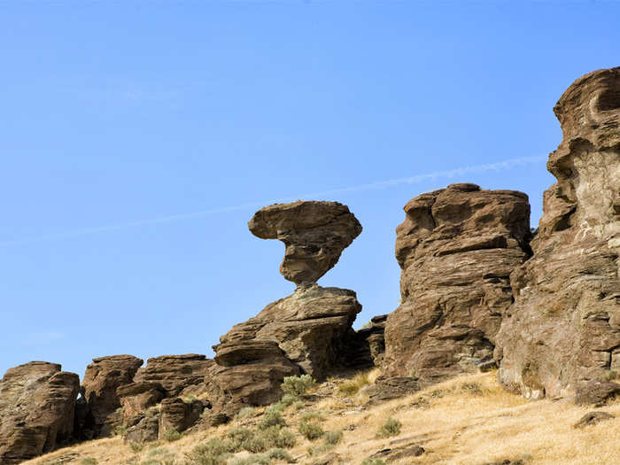 IDAHO: Balanced Rock is exactly what it sounds like: a 48-foot tall rock that is perched precariously on an approximately 3-foot pedestal. After getting a close-up look at the rock, have a picnic in nearby Balanced Rock Park.