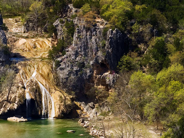 OKLAHOMA: Turner Falls Park is located within the Arbuckle Mountains in Oklahoma, and offers a bunch of outdoor activities. See the 77-foot waterfall, swim in the mountain water, and make sure to visit the abandoned Collings Castle.