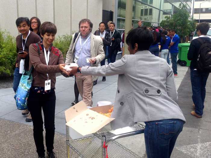 Google was handing out donuts to attendees waiting in line. This girl took one.