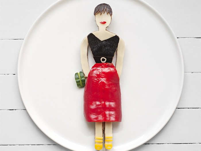 She officially took a one-year leave of absence from her statistics job in August, deciding to devote herself more seriously to her photography. She collaborates with newspapers, magazines, and advertising agencies on food art projects, like this "Fashionable Food" spread she did for the September 2013 issue of British Vogue. This photo was inspired by Prada