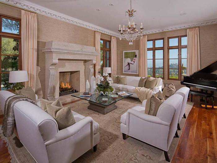 The white furniture in this formal living room makes it feel especially chic.