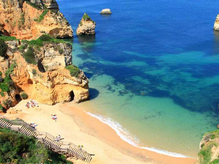 Lounge on the stunning beaches of Lagos, in Portugal.