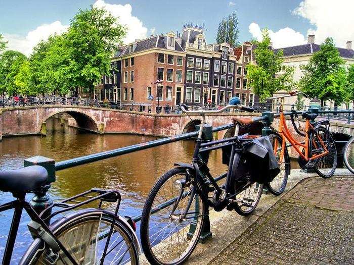 Bike alongside the canals of Amsterdam, the Netherlands.