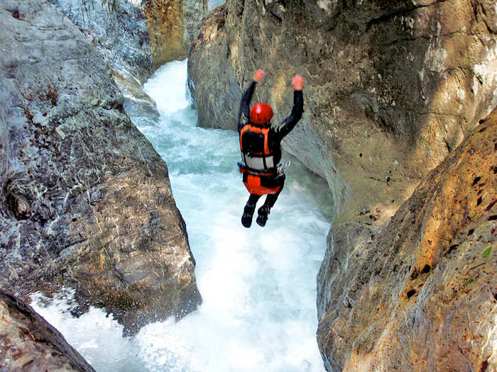 Go canyoning in Interlaken, Switzerland: rappel, raft, and jump through waterfalls.