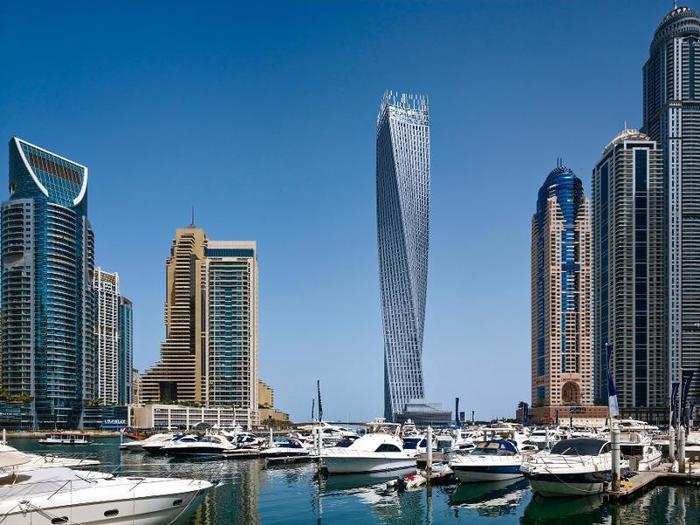 WINNER (Middle East & Africa): Cayan Tower, Dubai. This residential tower is a 75-story luxury apartment building. Its helical shape turns 90 degrees over the course of its 1,005-foot height, so no room is facing the same way as the one above or below.