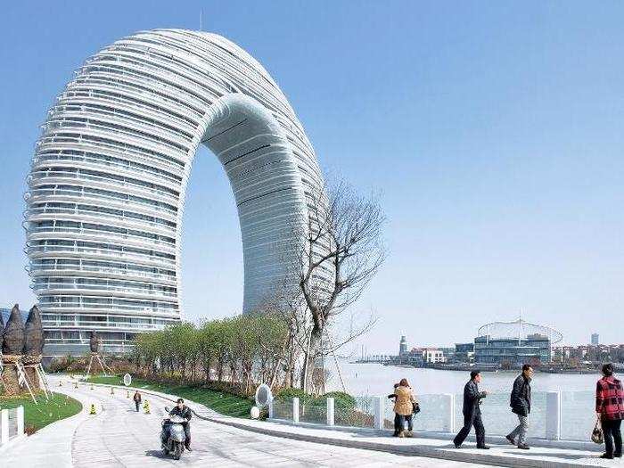 FINALIST (Asia & Australasia): Sheraton Tai Lake Resort, China. This 335-foot-tall ring-shaped hotel provides all the rooms with waterfront and city views, and is reflected on the Nan Tai Lake.