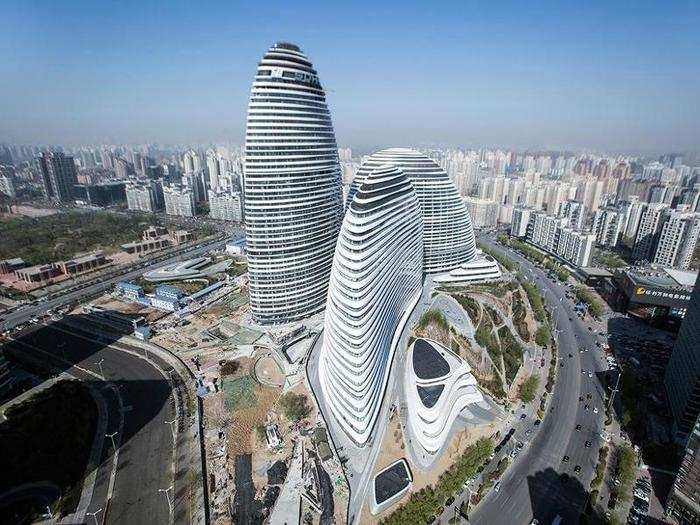 FINALIST (Asia & Australasia): Wangjing SOHO, Beijing. The Wangjing SOHO Project consists of 656-foot-tall office towers that are designed to reflect the constant movement of the "city, the sun, and the wind" in Beijing.