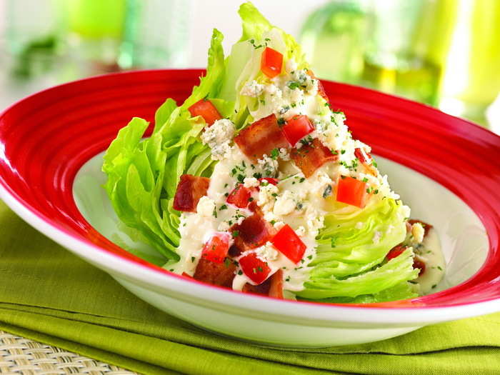 25. America does "healthy" with wedge salads...a wedge of lettuce covered in creamy dressing and bacon.