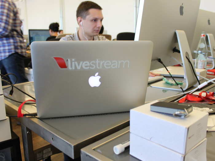 Nearly every laptop in the room looks like this one, decked out with Livestream stickers.