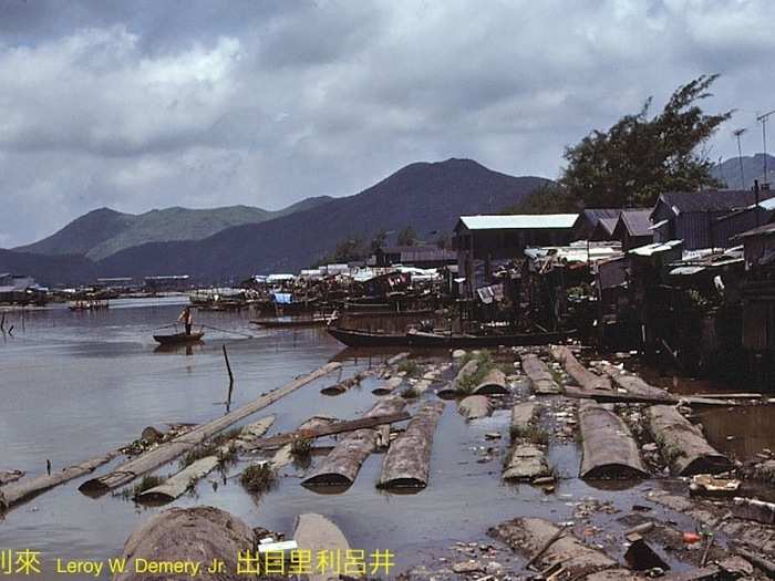 An inlet, probably north of Avenida do Almirante Lacerda. "The mountains in the background are on the Mainland. If the location is correct, then this is very much a 