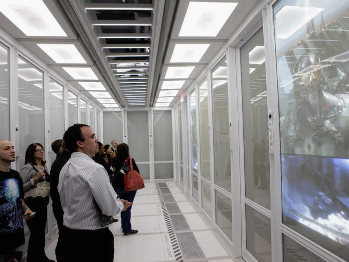 Fans get ushered into an all-white room where they