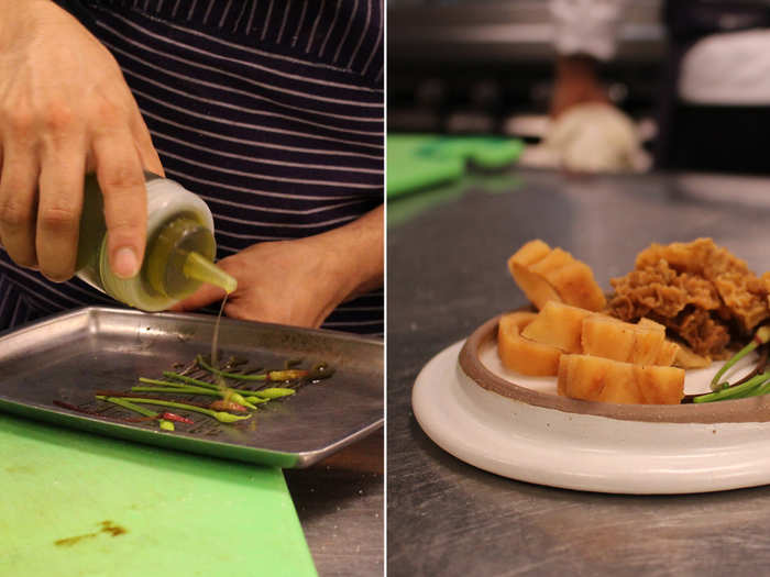 He drizzles the garlic scapes with acid to balance out the flavor, and cuts the morels into 1-inch chunks. Both are tossed into a pan and sautéed. On the back burner, garlic root steeps in a pot of broth.