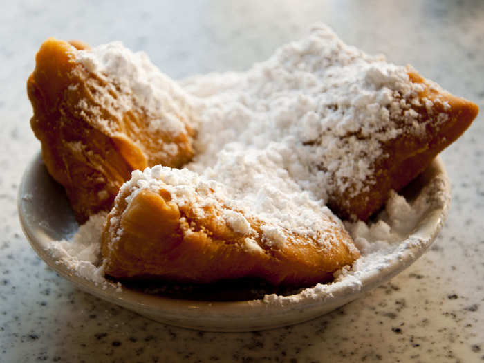 LOUISIANA: Beignets—deep-fried dough topped with powdered sugar—are an iconic New Orleans dish, and Cafe Du Monde is the most famous place to get them.