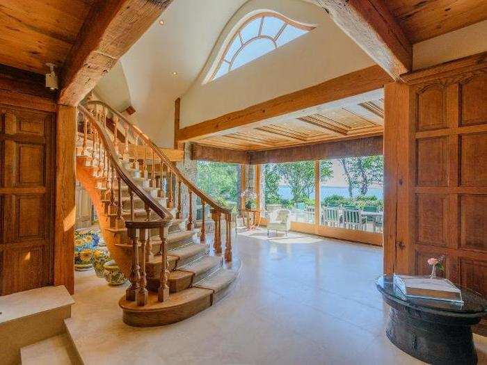 The six-bedroom, eight-bathroom mansion is designed with wood accents.