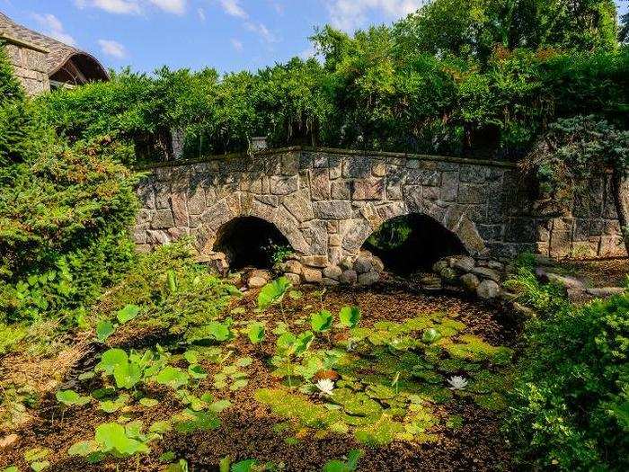 The landscaping definitely has a natural feel. Here is a pond full of lily pads under a stone bridge.