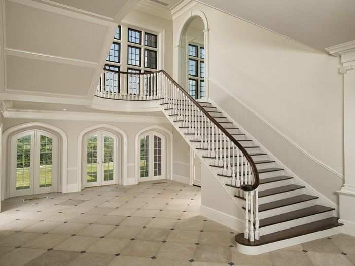 The entrance room has limestone floors and a coved ceiling.