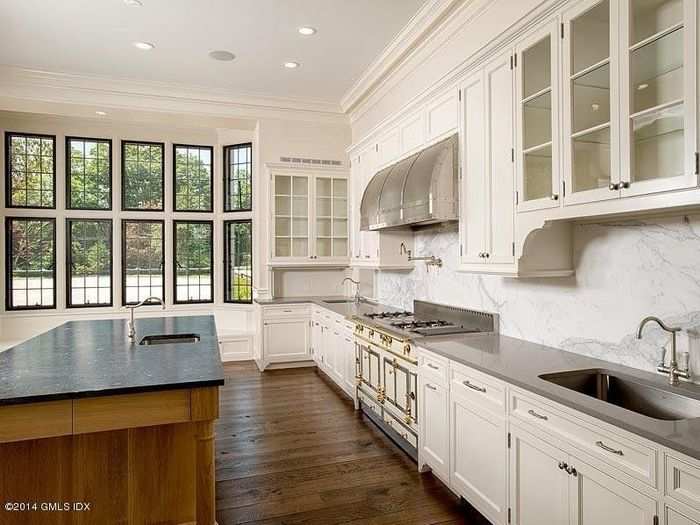 The kitchen is spacious and features a window seat and an oak center island.