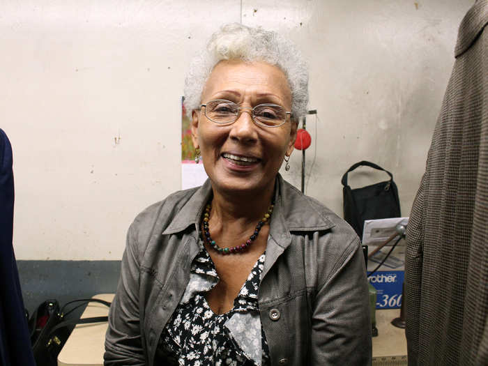 Celeste Suarez says when she started 22 years ago, she "did everything.” Now, she carefully inspects each jacket before it leaves the production floor for the tailor’s shop.