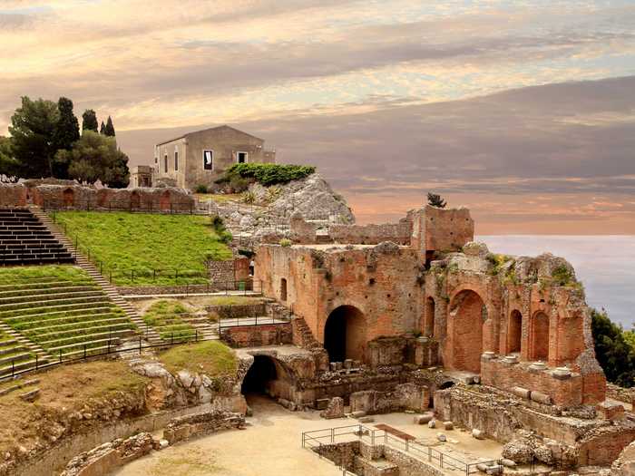 Step back in history and explore the ancient Greek ruins of the Temple of Concord and Theater of Taormina in Sicily.