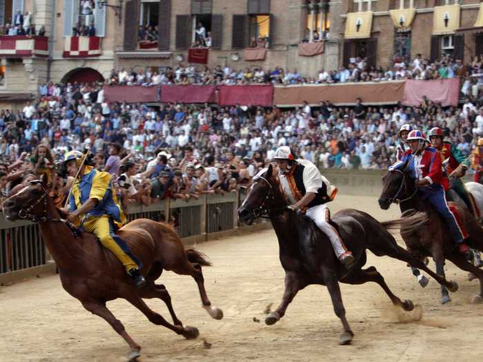 Cheer on the riders at the Palio di Siena bareback horse race, which takes place in Siena twice each year: on July 2nd and August 16th.