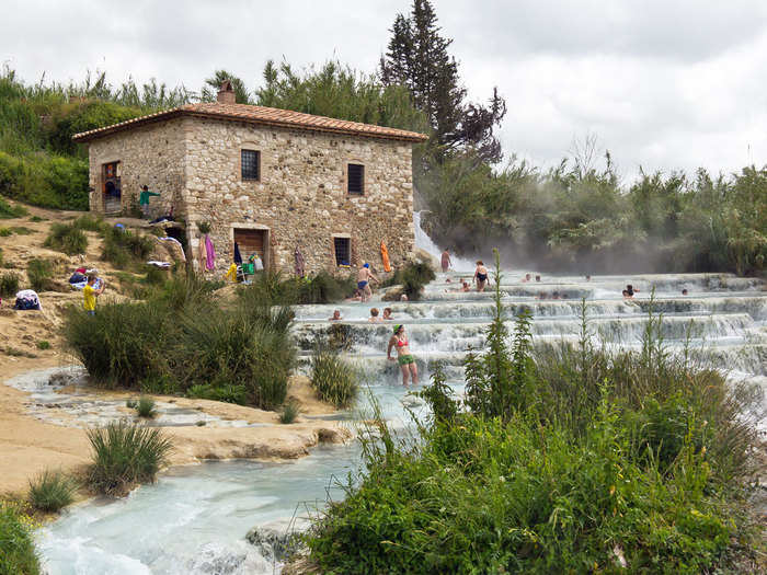 Take a dip in the natural spas of Saturnia in Tuscany, where gorgeous hot springs flow freely.