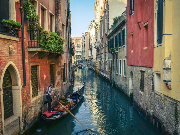 Take a gondola ride through the magnificant canals in Venice.