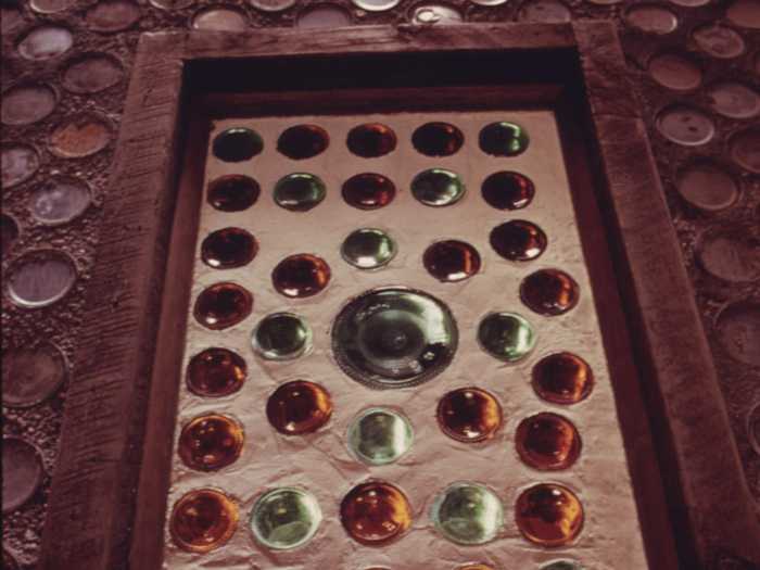 Aside from the foundation, Reynolds used other "garbage" for portions of the house, like bottles as stained-glass windows.