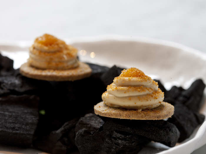 The meal begins with a canape of ginger biscuit topped with foie gras and gingerbread crumbs.