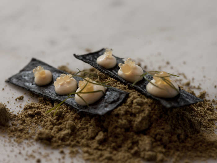 Turbot roe cream and apple jelly sit on top of squid ink biscuits, making for a unique sweet-savory combination.