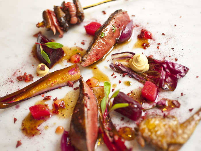 One of the more savory courses is a haunch of muntjac, or venison, with red vegetables and rhubarb.