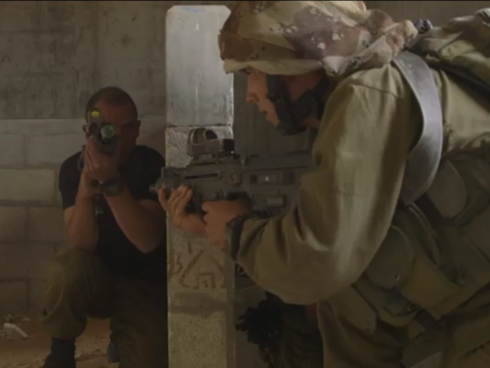 After the Israeli soldier moves quietly up the stairs, he manages to fire at the enemy before he has a chance to react.