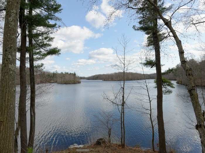 It sits on over 32 acres of land with a lake, nature trails, and extensive gardens.