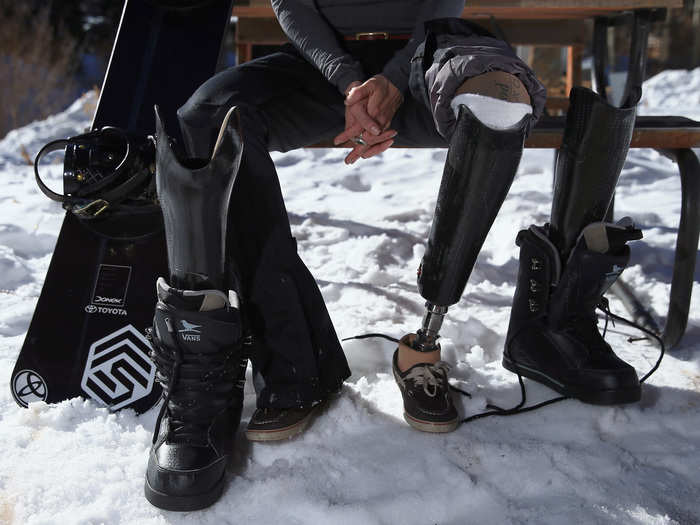 While her snowboarding prosthetics are actually just adapted from ones for walking, she is able to adjust the ankle height and suspension. She also wears men