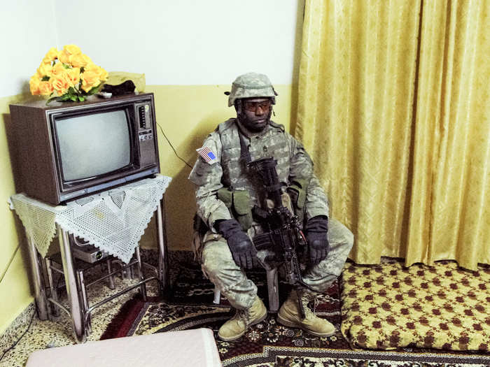 In Iraq, the army drove through cities during "presence patrols," which Van Agtmael says soldiers called "waiting to get blown up." Raids for insurgents were also common. Unfortunately, most raids, like the one pictured here, were unsuccessful.