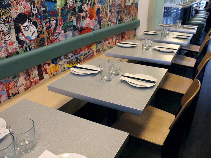 The restaurant is laid out railroad-style, with a long row of tables for two and larger tables toward the kitchen.