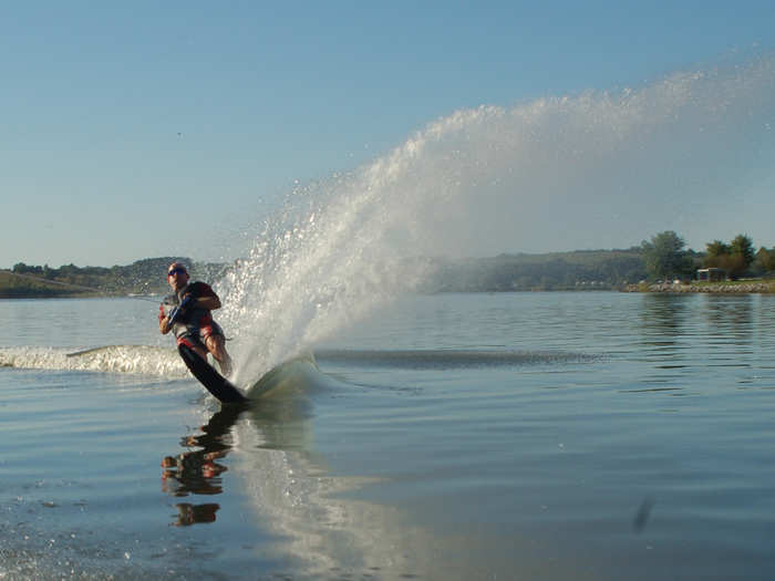 Waterski on a lake.