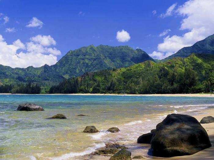 Lay out at Hanalei Bay Beach in Kauai, Hawaii, which we named the Best Beach in America.