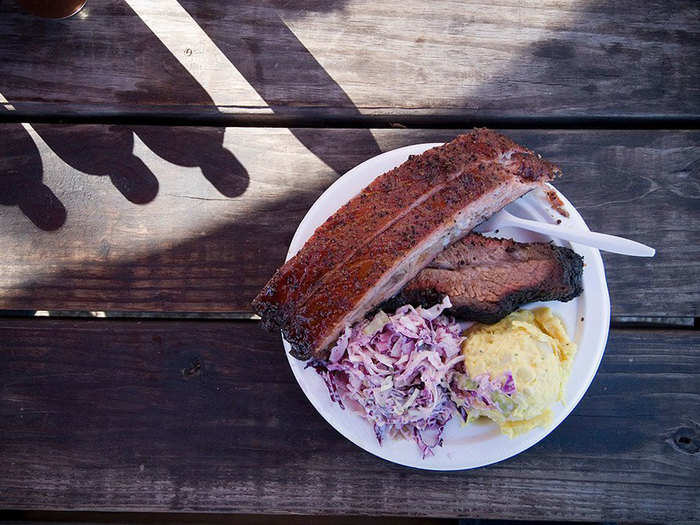 Eat some BBQ at Franklin Barbecue in Texas, the best BBQ joint in America.