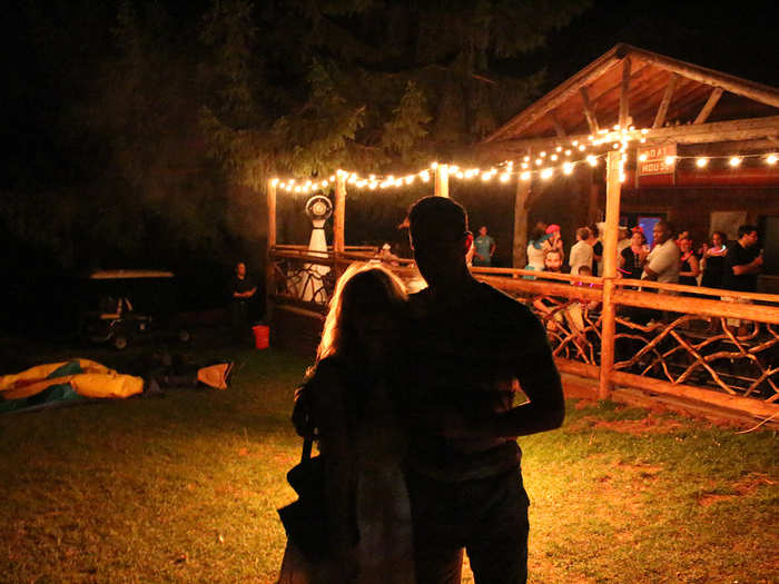 After the meal, everyone takes their time moseying over to the boathouse, where a party is about to start. While some cliques disappear to drink in their cabins and hang in the woods, I head to the dance floor with some new friends.