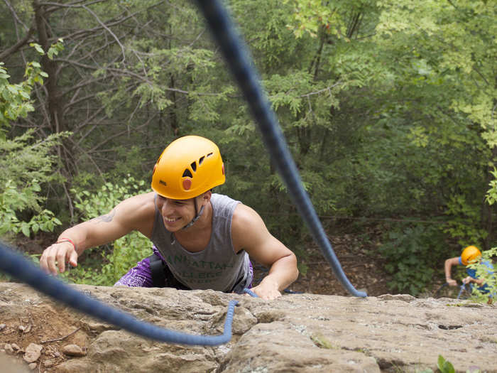 We hike for 10 minutes up the mountain that overlooks camp, which gave me an opportunity to ask my fellow campers the basics: their names, hometowns, and occupations. By the time we start rock climbing, we