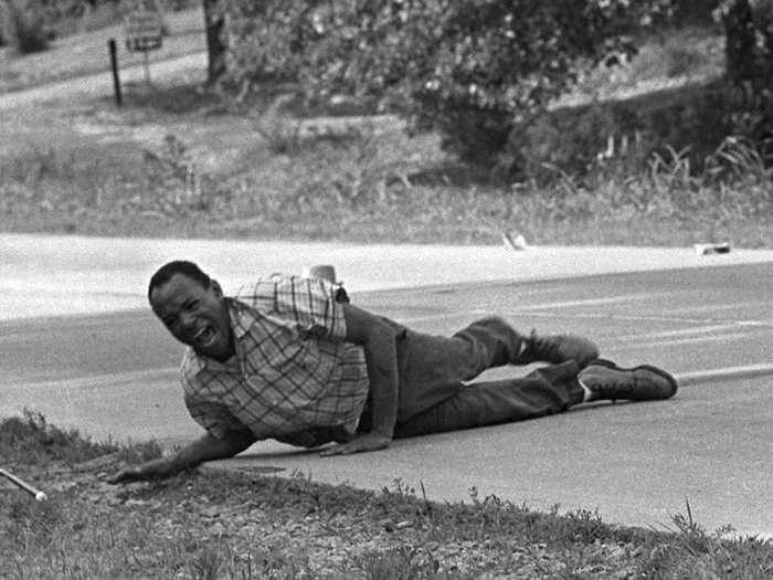 In this photo, which won in 1967, civil rights activist James Meredith grimaces in pain as he pulls himself across Highway 51 after being shot in Hernando, Mississippi, in the summer of 1966. Meredith was leading the March Against Fear to encourage African Americans to vote when he was shot. He completed the march from Memphis to Jackson, Mississippi, after his wounds were treated. The photo was taken by Jack Thornell.