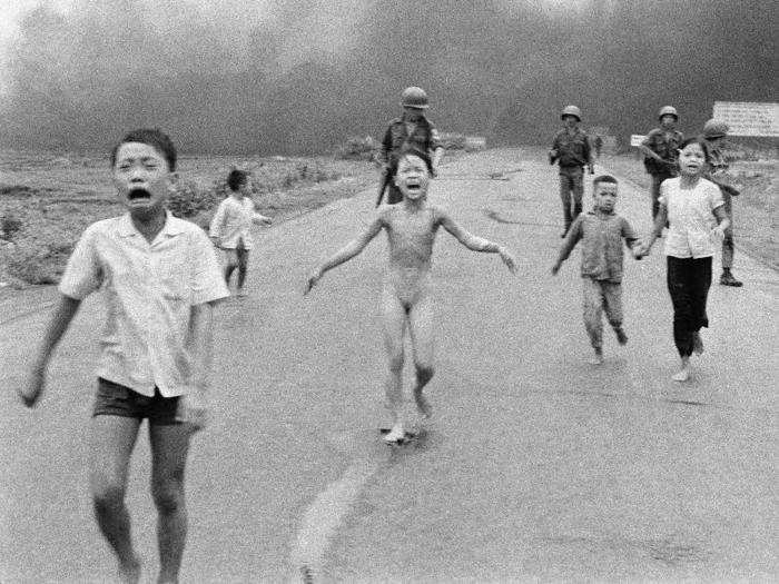 South Vietnamese forces follow after frightened children, including 9-year-old Kim Phuc, center, as they run down a road, after a South Vietnamese plane accidentally dropped flaming napalm on its own troops and civilians. The terrified girl had ripped off her burning clothes while fleeing. This photo, taken by Vietnamese-born war photographer Nick Ut, won the Prize in 1973.