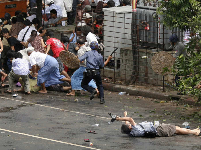 Reuters photographer Adrees Latif won the Pulitzer Prize for Breaking News Photography in 2008 for this picture of a Japanese videographer shot during a governmental crackdown on demonstrators in Myanmar. The reporter, Kenji Nagai, still attempted to videotape the violence as he lay injured after police shot him. Nagai would eventually die from his wounds.