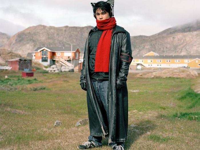 Pavia Ludvigsen, seen here, is certainly an interesting figure walking around Sisimiut, Greenland in his full length leather coat and cat ear headphones. Sisimiut is 47 miles north of the Arctic Circle and has a population of only 5,598 people, which still makes it the second most-populous town in Greenland.