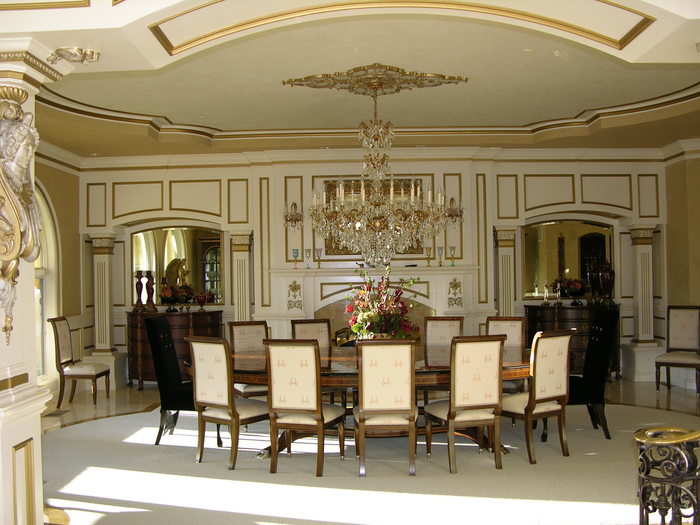 While the 12-person formal dining room has gold-trimmed walls and a Swarovski crystal chandelier.