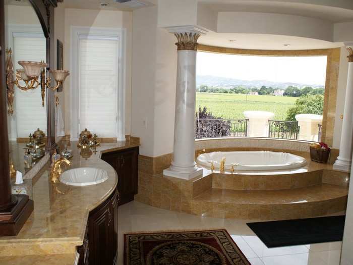 The columns continue into the master bathroom. Check out the view by the bath.